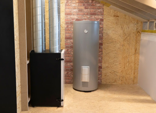 A storage tank water heater installed near a heating system in a home.